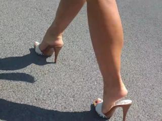 Wife's feet in high heels mules 2 of 14