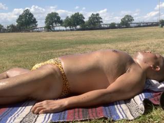 Sunbathing in Bayonne Park in my Yellow animal print bikini 6 of 17