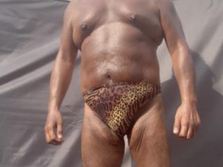 Backyard sunbathing in animal print 3 of 18