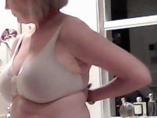 Hidden cam of wife removing her bra 8 of 9