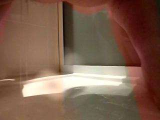 Closeup pissing in shower
