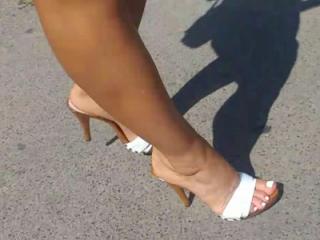 Wife's feet in high heels mules 9 of 14