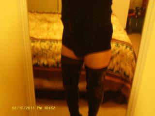 Boy shorts, leather thigh high boots 1 of 9