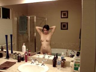 Naked in the mirror after the bath.