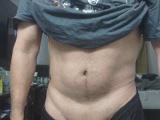 Wearing my kiss shirt and flexing my little muscle 6 of 8