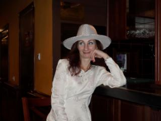 In Wedding Dress and White Hat on stage 6 of 20