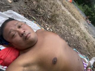 Sunbathing in Park in Purple striped G-string 6 of 6