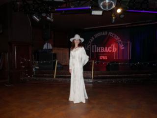 In Wedding Dress and White Hat on stage 13 of 20