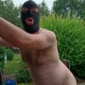 FKK Man with Mask in Garden