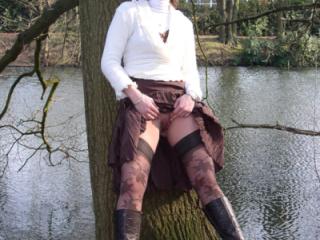 Young wife flashing in the city park