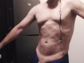 Old guy showing his small muscles 7 of 13