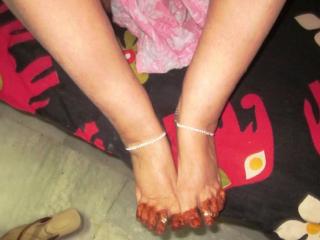 Beautiful feet wearing different kind of chain