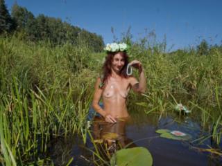 In pond with waterflowers 4 of 20