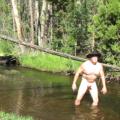 Naked bathing in the stream.