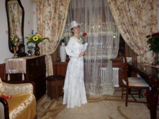 In Wedding Dress and White Hat 2 of 20