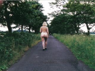 Mature nude walks in English country lane at one with nature 2 of 4