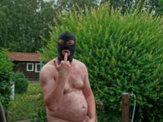 FKK Man with Mask in Garden 7 of 10