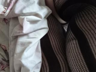 Sundress and stockings on the bed