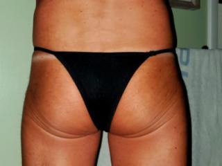 Tiny black thong 9 of 18