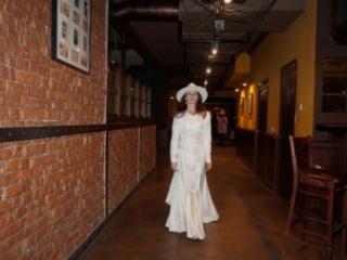 In Wedding Dress and White Hat on stage 3 of 20