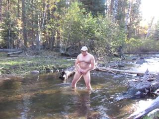 Jerking it in the river.
