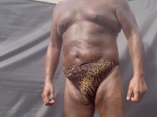 Backyard sunbathing in animal print 8 of 18
