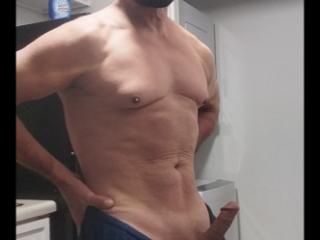 Old guy showing his small muscles 4 of 13
