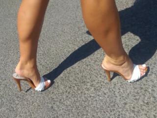 Wife's feet in high heels mules 7 of 14