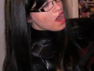 Eager to Choke on Your Cock in My Shiny Black Catsuit 1 of 15