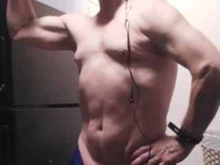 Old guy showing his small muscles 3 of 13
