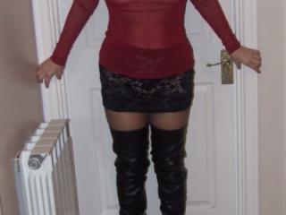 Jane wears red and adds thigh boots 5 of 14