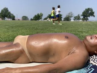 Sunbathing in Bayonne Park_Nude/tan/skin CK thong 12 of 18
