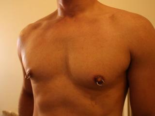Freshly shaven and nipple rings 1 of 4
