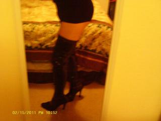 Boy shorts, leather thigh high boots 3 of 9