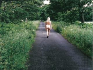 Mature nude walks in English country lane at one with nature 3 of 4