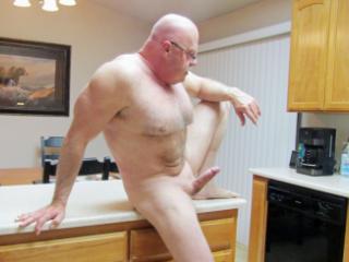 Naked and hard in the kitchen.