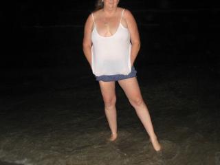 Wife showing off what she has to some big cocks at a beach party