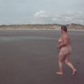 Denise running on Morfa Dyffryn nudis...