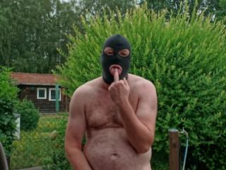 FKK Man with Mask in Garden 8 of 10