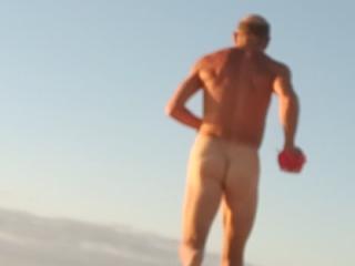 Celebrating 66 with a nude run on the beach.