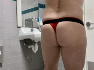 Wearing red thong to work 1 of 5