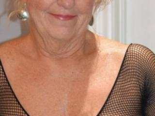 Tits and Shaved Pussy Seen through Fishnet Bodystocking 6 of 19