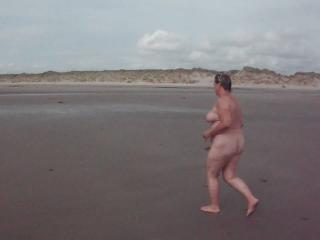 Denise running on Morfa Dyffryn nudist beach