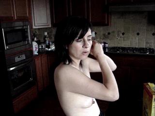 Naked tits in the kitchen.