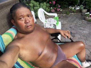 Sunbathing in my backyard in brown thong!!! I bet I STINK! 12 of 19