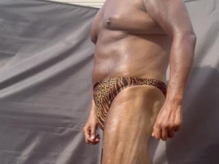 Backyard sunbathing in animal print 9 of 18