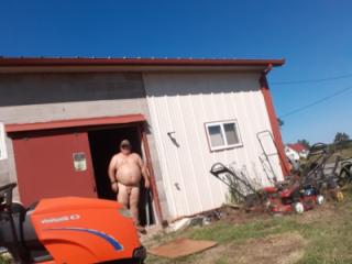 Mowing  in Birthday suit outside 2 of 8