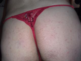 Red lace thong and jeweled plug 14 of 15