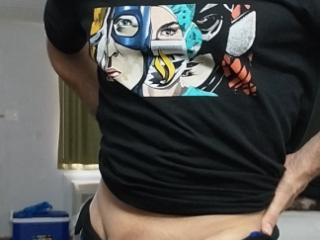 Wearing my kiss shirt and flexing my little muscle 4 of 8
