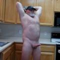 Naked weightlifting in the kitchen.